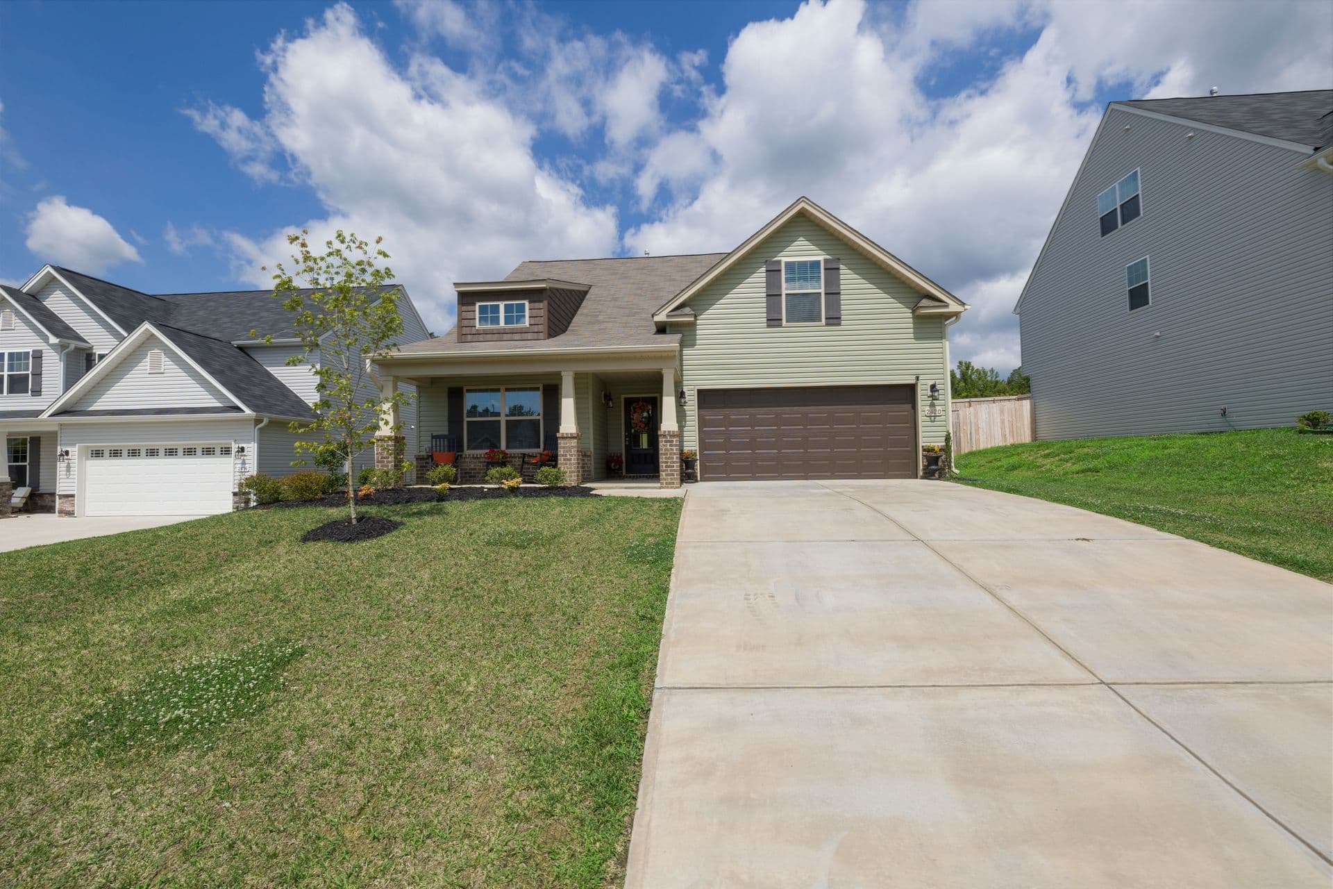 Modern suburban home with a freshly paved driveway
